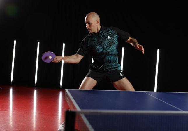 Image capturing a JOOLA Table Tennis Pro mid swing.